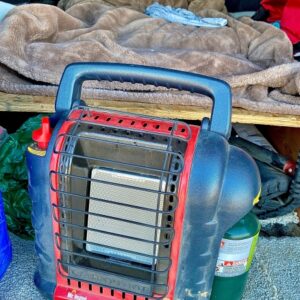 Mr. Buddy Heater with a green propane bottle attached.